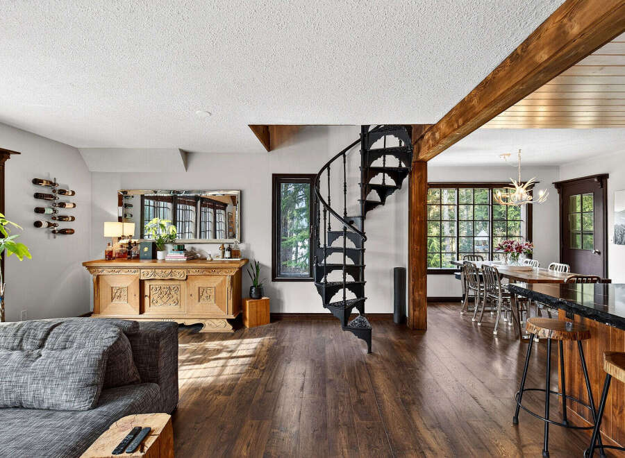 Step into luxury with this stunning property featuring a spiral staircase, hardwood floors, and a gourmet kitchen.