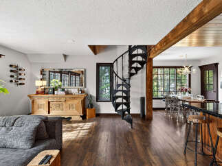 Step into luxury with this stunning property featuring a spiral staircase, hardwood floors, and a gourmet kitchen.