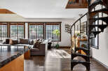 Step into luxury with this stunning property featuring a spiral staircase and a beautifully designed living space.