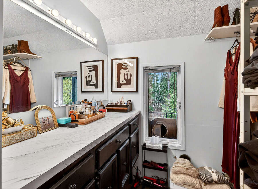 Step into luxury with this stunning vanity area, perfect for getting ready in style.