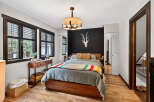 This stunning bedroom boasts a modern design with a touch of rustic charm.