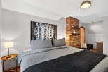Discover the charm of this inviting bedroom, featuring a cozy bed adorned with stylish bedding.