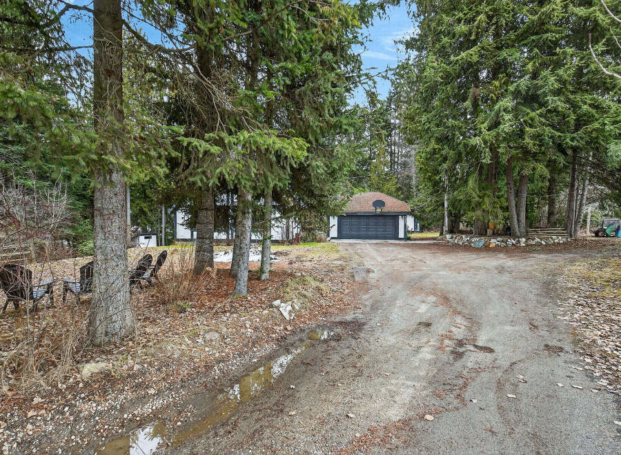 Discover the tranquility of this charming property nestled amidst lush greenery.