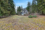 Nestled amidst lush greenery, this charming property boasts a unique architectural design.