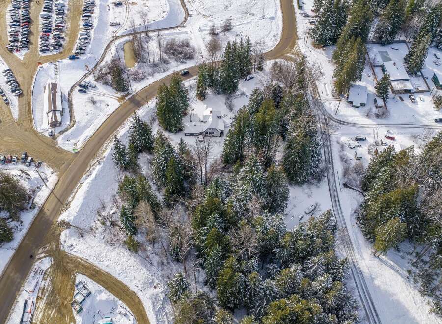 Nestled in a winter wonderland, this property offers a serene escape.