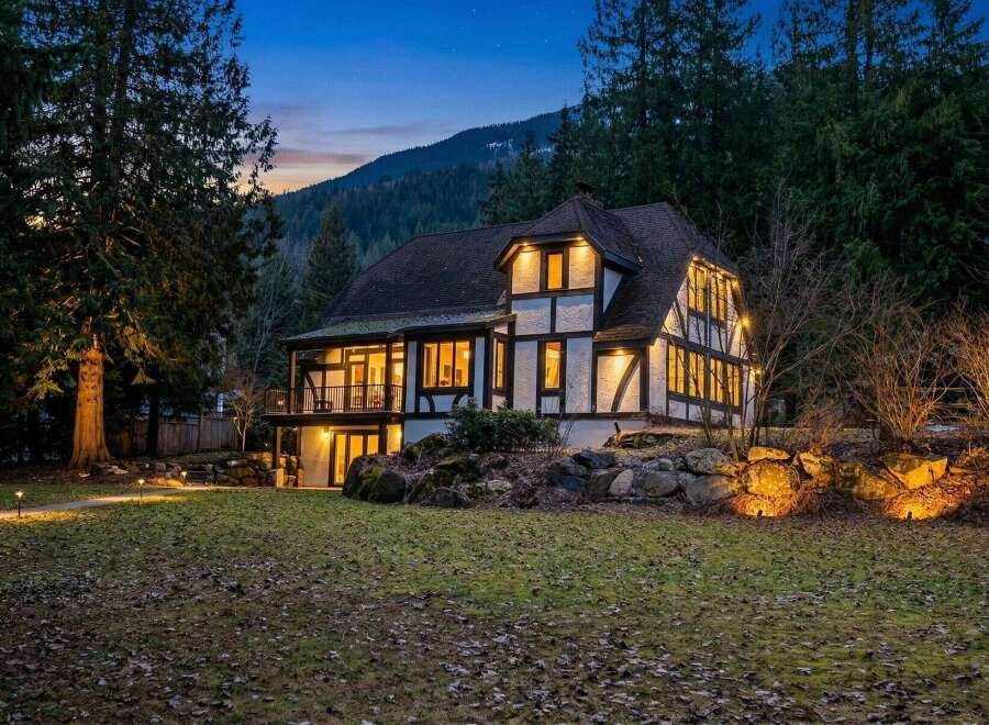 This stunning Tudor-style home offers a blend of classic charm and modern elegance.