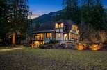 This stunning Tudor-style home offers a blend of classic charm and modern elegance.