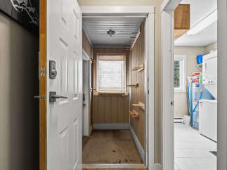 Step into this inviting home and discover a functional entryway leading to a well-organized laundry area.