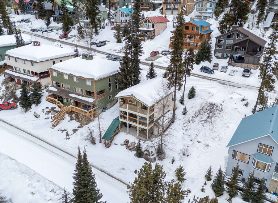 Nestled in a snowy mountain landscape, this property offers a unique blend of comfort and natural beauty.