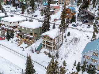 Nestled in a snowy mountain landscape, this property offers a unique blend of comfort and natural beauty.