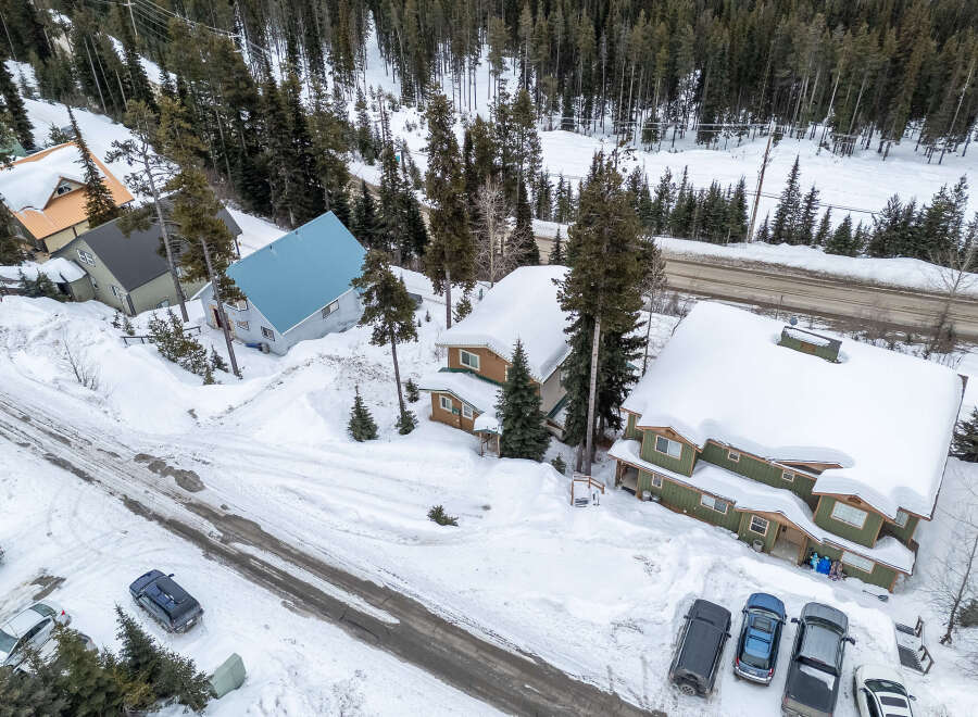 Nestled in a winter wonderland, this property offers a cozy retreat with stunning views.