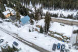 Nestled in a winter wonderland, this property offers a cozy retreat with stunning views.