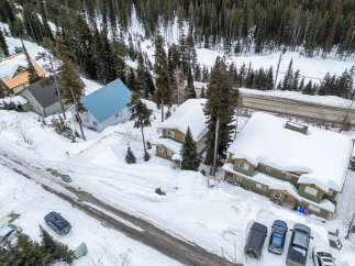 Nestled in a winter wonderland, this property offers a cozy retreat with stunning views.