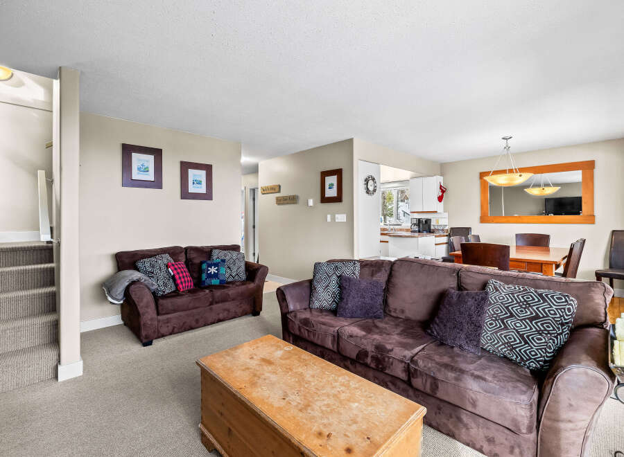 This cozy living space features a comfortable brown sofa, perfect for relaxing.