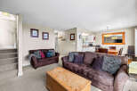 This cozy living space features a comfortable brown sofa, perfect for relaxing.
