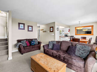 This cozy living space features a comfortable brown sofa, perfect for relaxing.