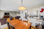 This inviting dining area seamlessly connects to the kitchen, creating a perfect space for entertaining.