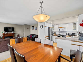 This inviting dining area seamlessly connects to the kitchen, creating a perfect space for entertaining.
