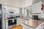 This charming kitchen boasts a bright and airy atmosphere, perfect for culinary adventures.