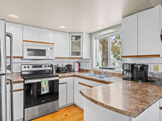 This charming kitchen boasts a bright and airy atmosphere, perfect for culinary adventures.