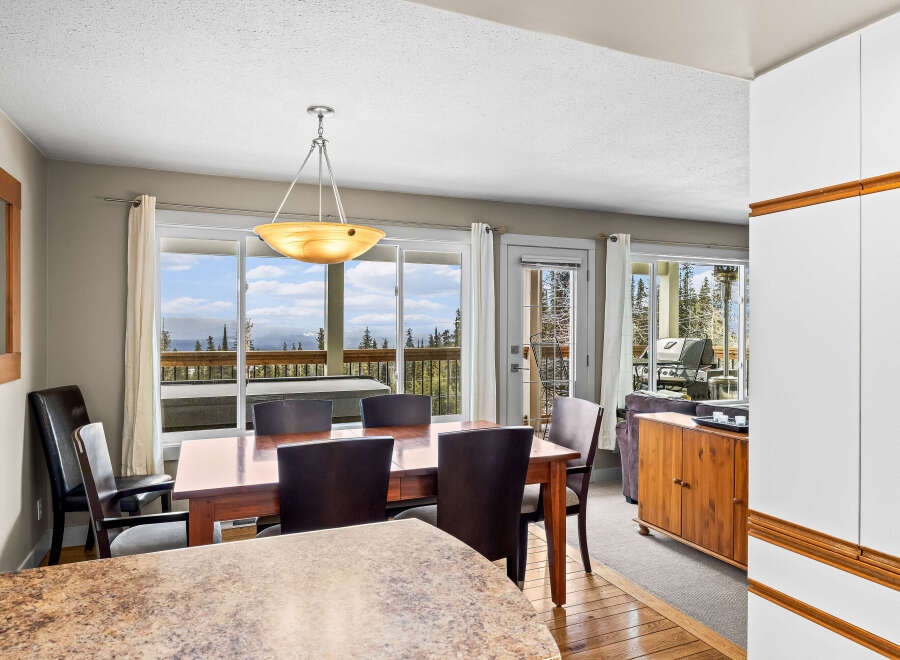 This stunning dining area offers breathtaking views of the surrounding landscape, perfect for enjoying meals with family and friends.