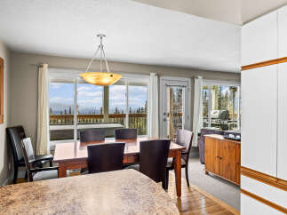 This stunning dining area offers breathtaking views of the surrounding landscape, perfect for enjoying meals with family and friends.