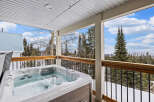 Relax and unwind in this stunning outdoor hot tub, perfect for enjoying the breathtaking mountain views.