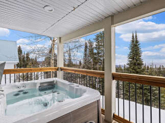 Relax and unwind in this stunning outdoor hot tub, perfect for enjoying the breathtaking mountain views.