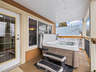 Relax and unwind in your own private oasis! This stunning property features a luxurious hot tub, perfect for enjoying the outdoors in any season.