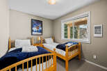This cozy bedroom features two twin beds, perfect for guests or children.