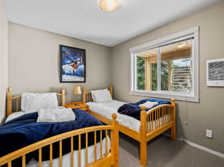 This cozy bedroom features two twin beds, perfect for guests or children.
