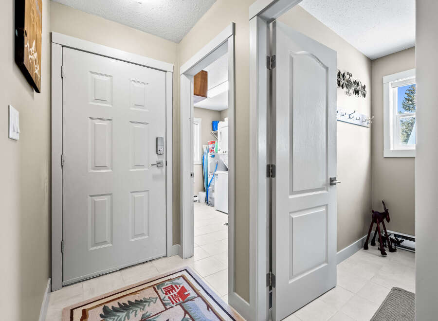 Step into this inviting entryway, showcasing a bright and airy atmosphere.