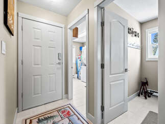 Step into this inviting entryway, showcasing a bright and airy atmosphere.