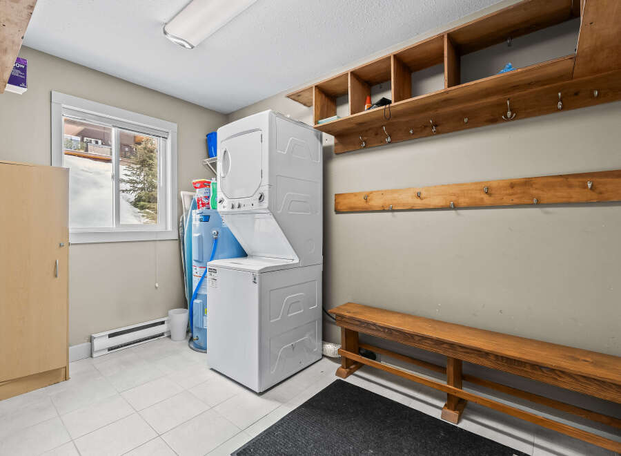 This laundry room offers a functional and organized space for all your washing needs.