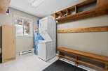 This laundry room offers a functional and organized space for all your washing needs.