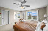 Experience the tranquility of this stunning bedroom, featuring a cozy bed and a breathtaking view.