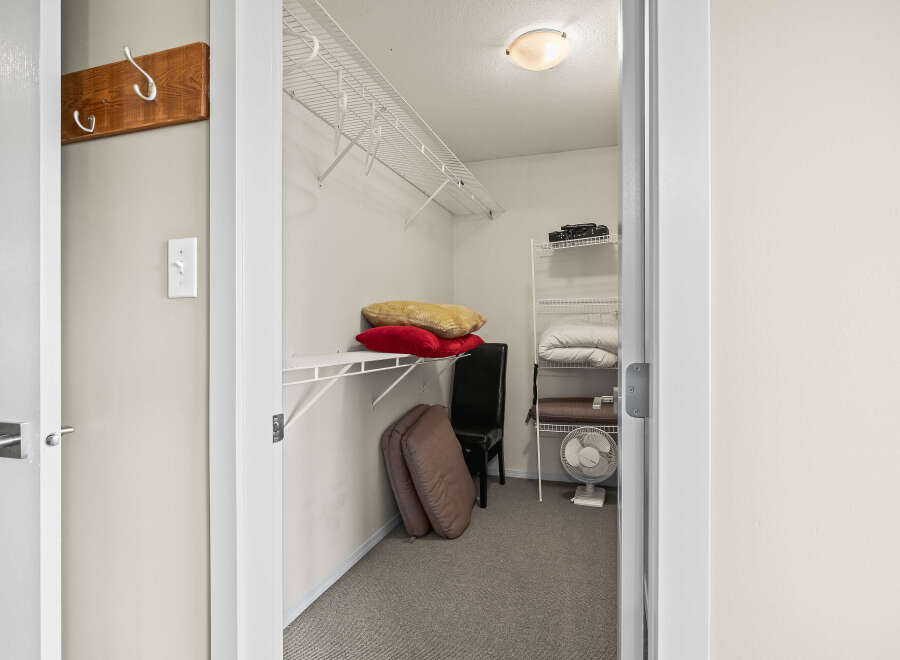 Step into this well-organized closet, perfect for maximizing storage space.