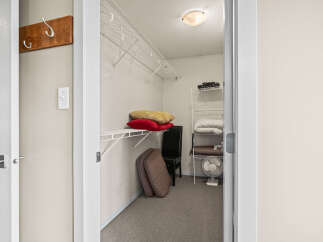 Step into this well-organized closet, perfect for maximizing storage space.