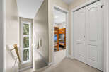 Step into this inviting home and discover a hallway leading to a cozy bedroom.