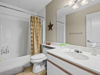 This bathroom features a clean and modern design, perfect for a relaxing retreat.