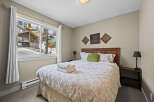 This cozy bedroom offers a serene retreat with its inviting ambiance and stylish decor.