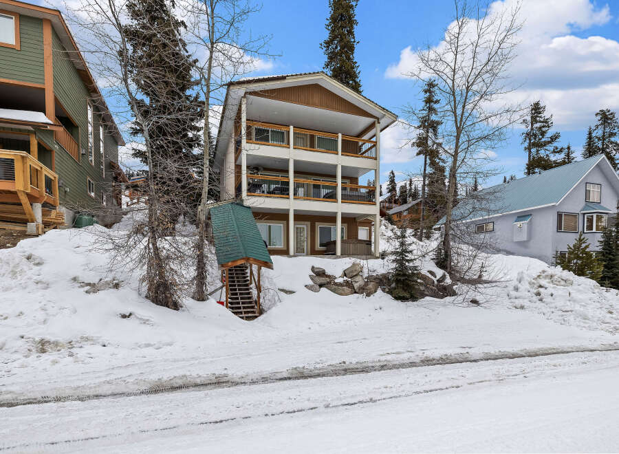 This stunning property boasts a multi-level design with spacious balconies, perfect for enjoying the scenic mountain views.