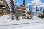 This stunning property boasts a multi-level design with spacious balconies, perfect for enjoying the scenic mountain views.