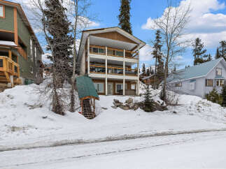 This stunning property boasts a multi-level design with spacious balconies, perfect for enjoying the scenic mountain views.