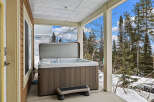 Relax and unwind in this stunning property featuring a luxurious hot tub, perfect for enjoying the beautiful outdoor scenery.