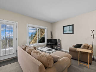 This cozy living space features a comfortable sofa, perfect for relaxing after a long day.