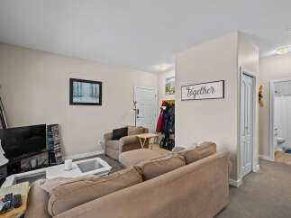 This cozy living space features a comfortable sectional sofa, perfect for relaxing.