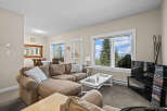 This cozy living room features a comfortable sectional sofa, perfect for relaxing after a day of outdoor adventures.