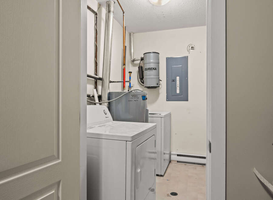 Step into the laundry room of your dreams! This space features a modern washer and dryer set, perfect for tackling your laundry needs.