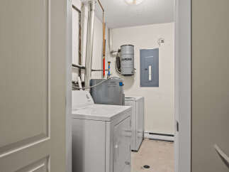 Step into the laundry room of your dreams! This space features a modern washer and dryer set, perfect for tackling your laundry needs.